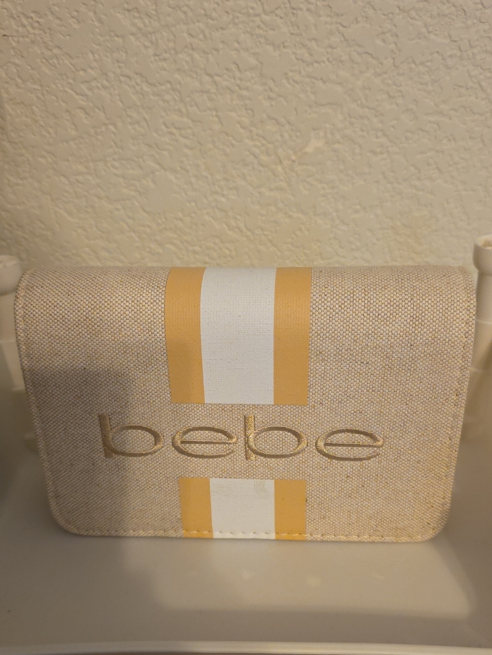 bebe Beige Clutch with Yellow and White Stripes